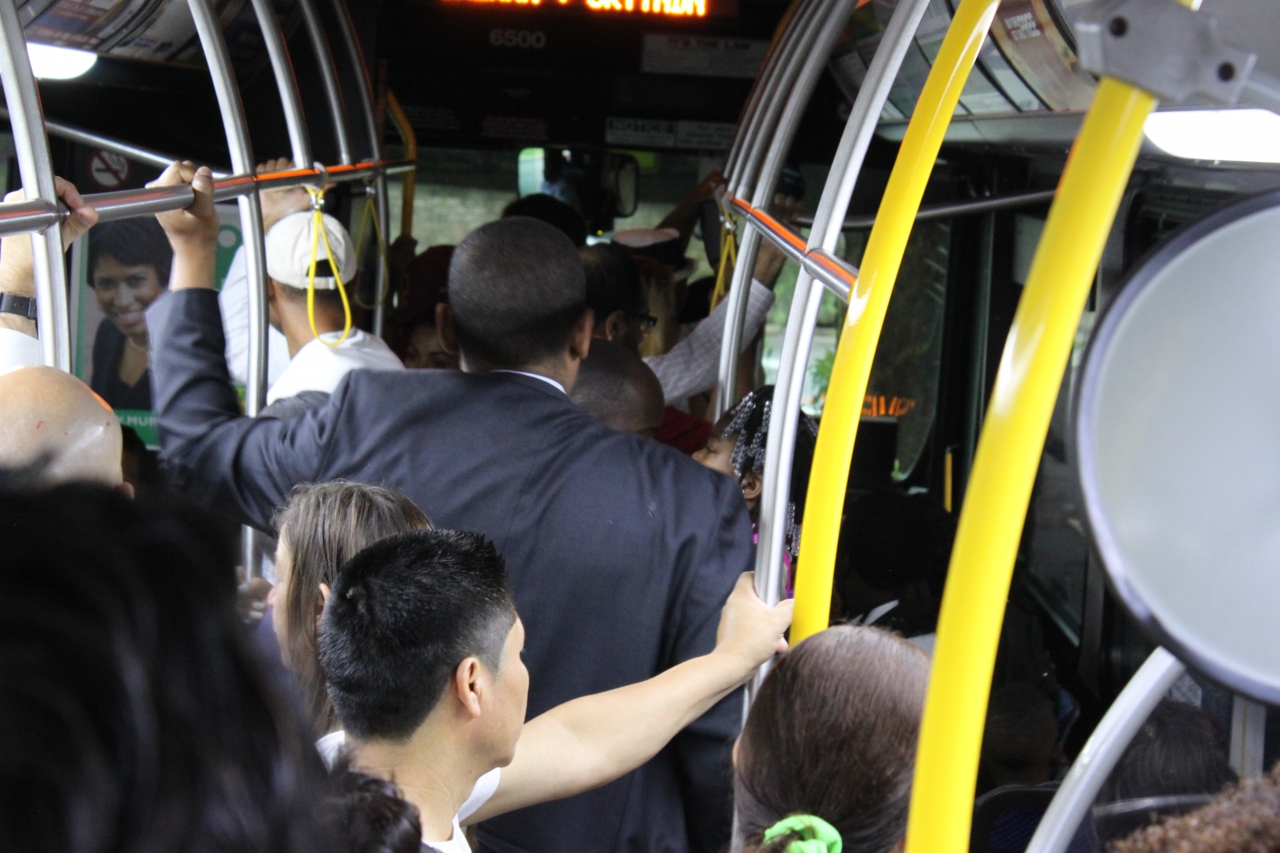 Photo of Secretary Foxx on a crowded 63 bus