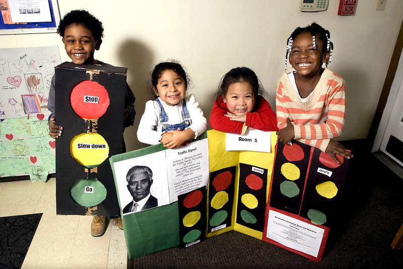 Photo of elementary school students with their Garrett Morgan presentation