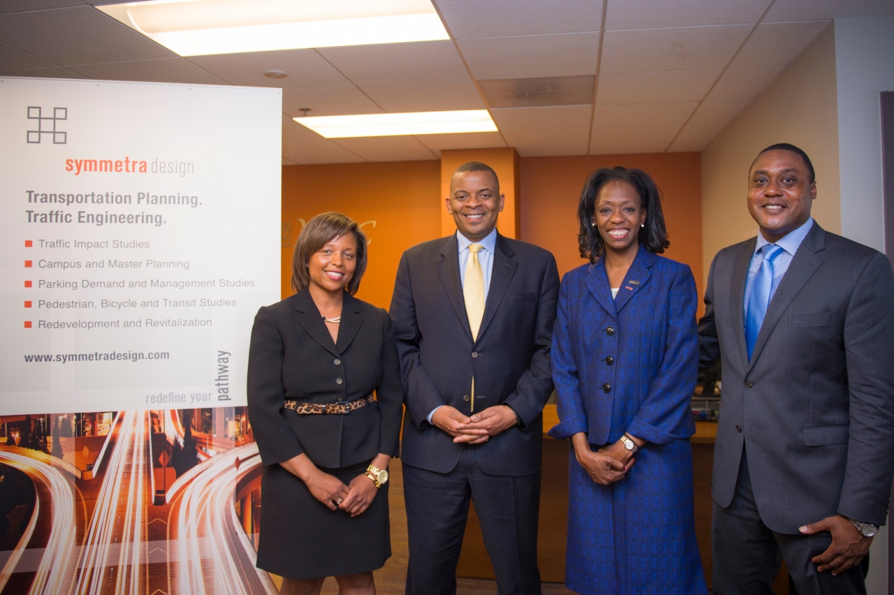 Photo of Secretary Foxx, OSDBU Director Brandon Neal and Symmetra executives