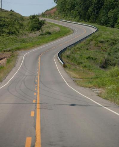 Two-lane road with no shoulders in rural area of Oklahoma.