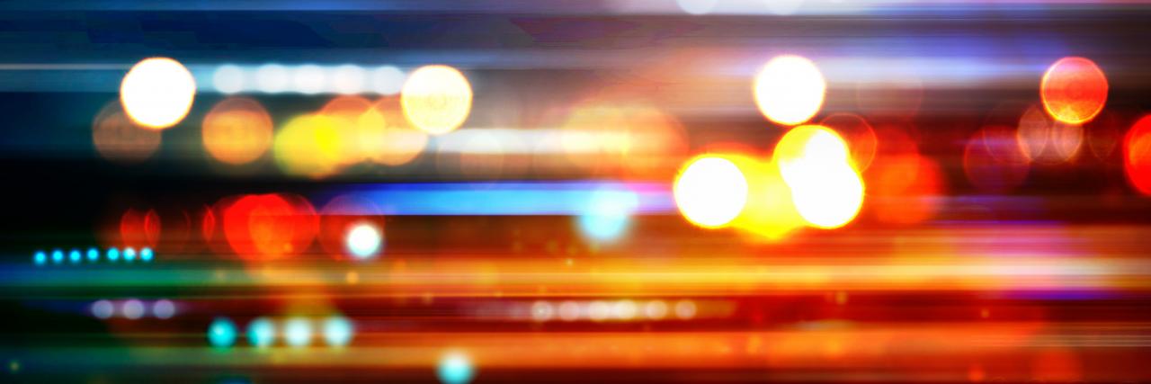 Blurred Defocused Lights of Heavy Traffic on a Wet Rainy Road