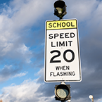 School Zone sign: Speed Limit 20 when flashing.