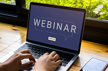 A computer screen showing the words "Webinar: Enter"
