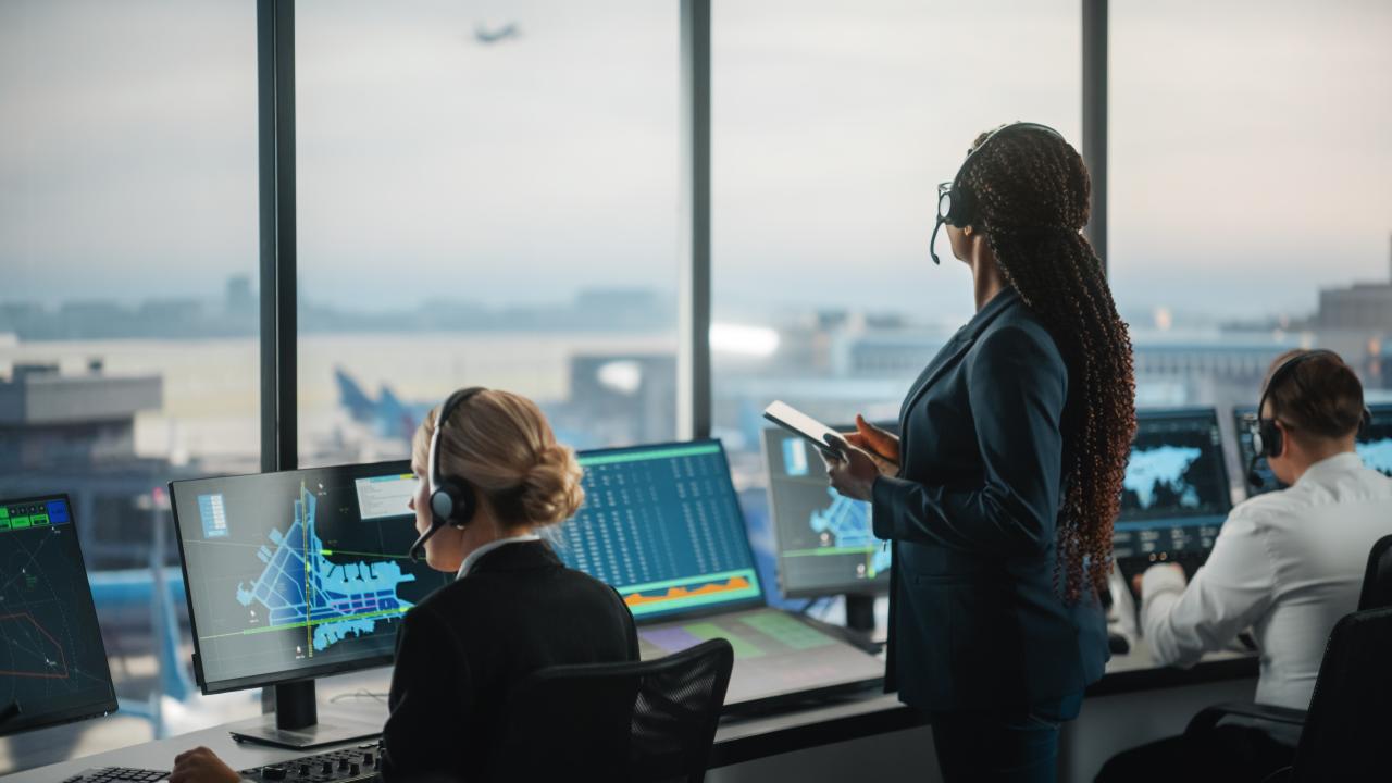 "An air traffic controller holds an iPad"