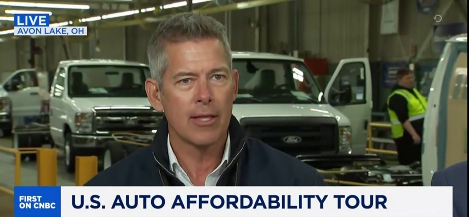 Screenshot of Secretary Duffy on CNBC with cars in background