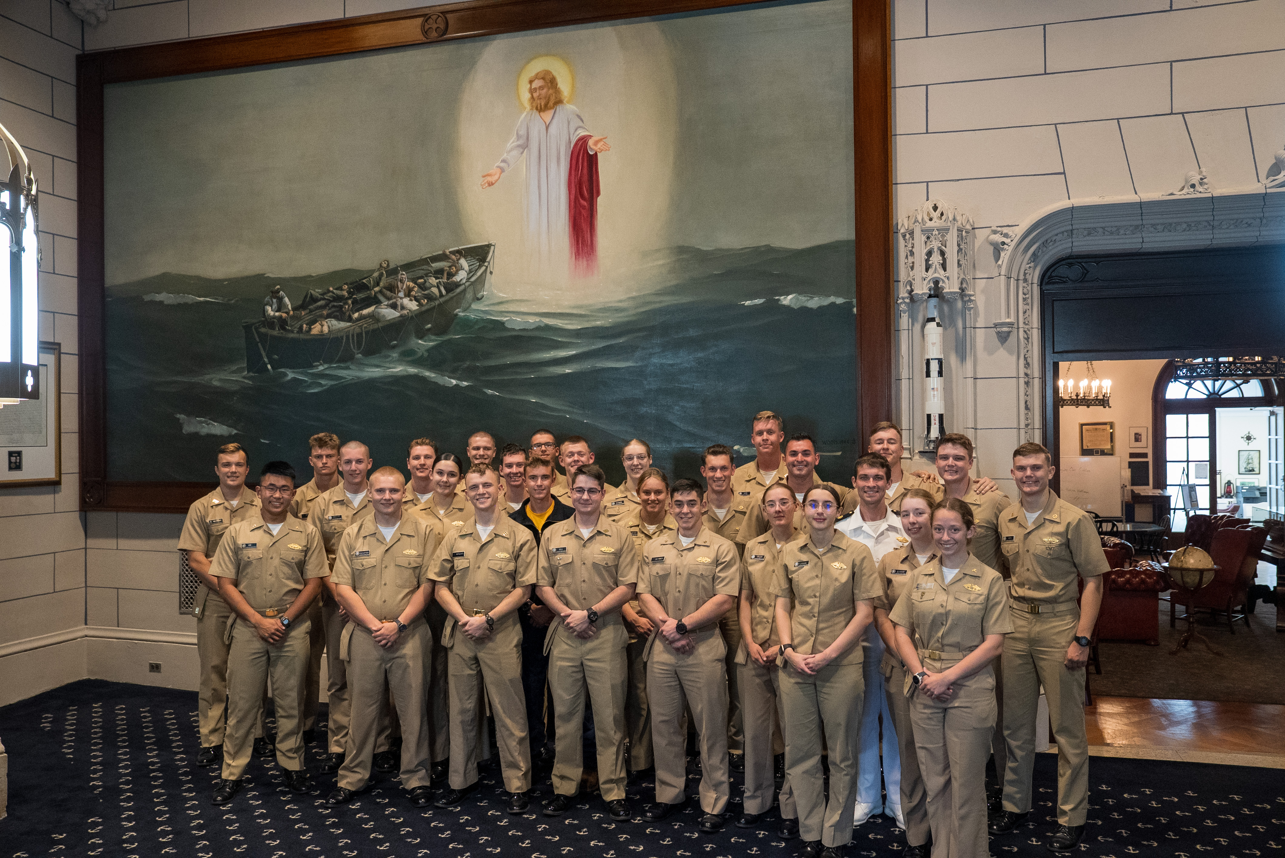 photo of midshipmen in front of the Christ on the Water painting hanging in Wiley Hall