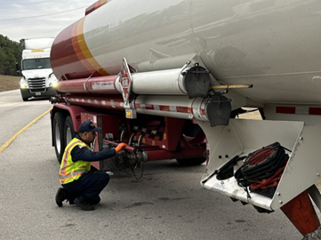 FMCSA inspector inspecting truck