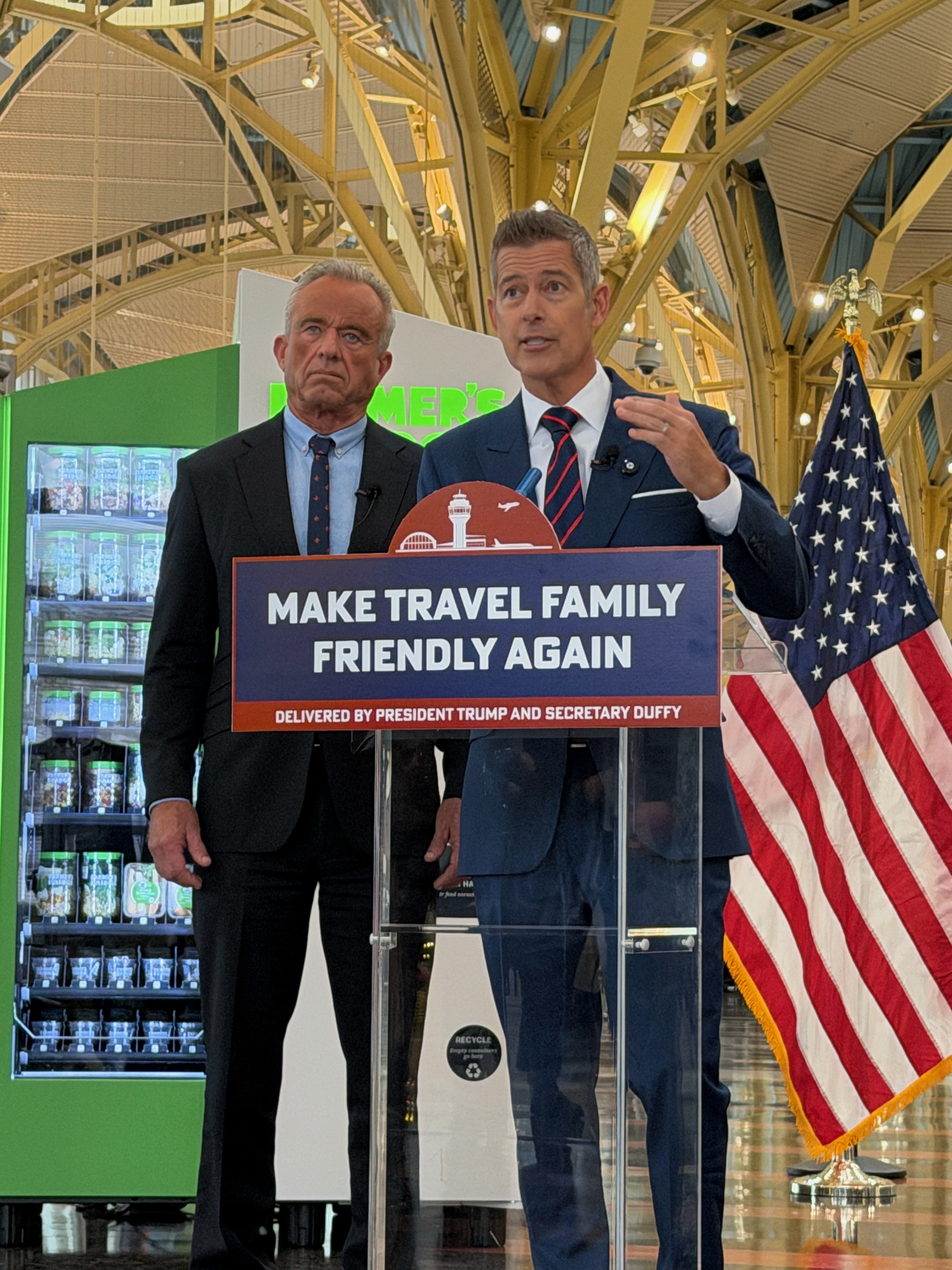 Secretary Duffy and Secretary Kennedy in front of podium for presser