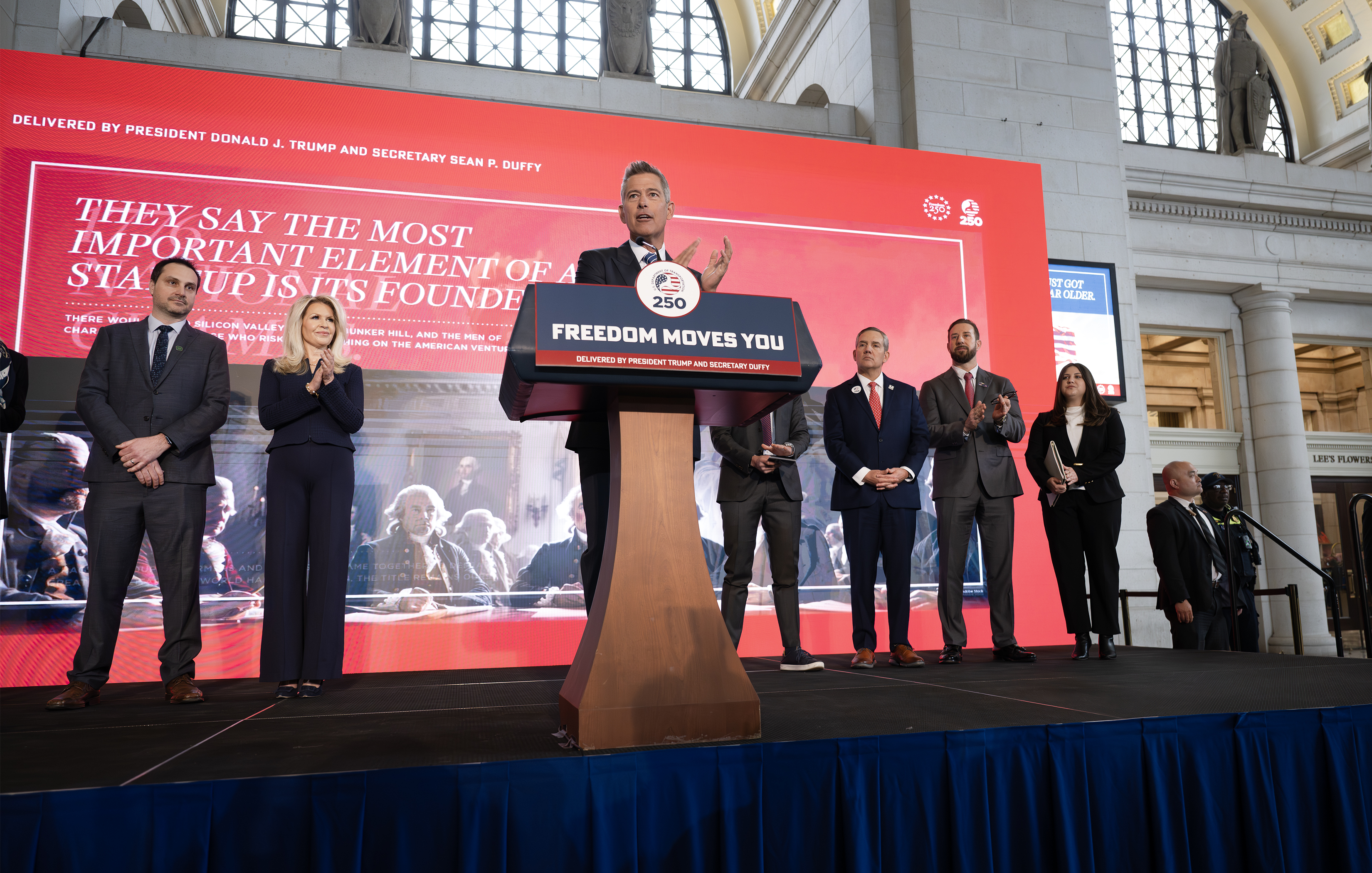 Secretary Duffy speaking on stage in Union Station