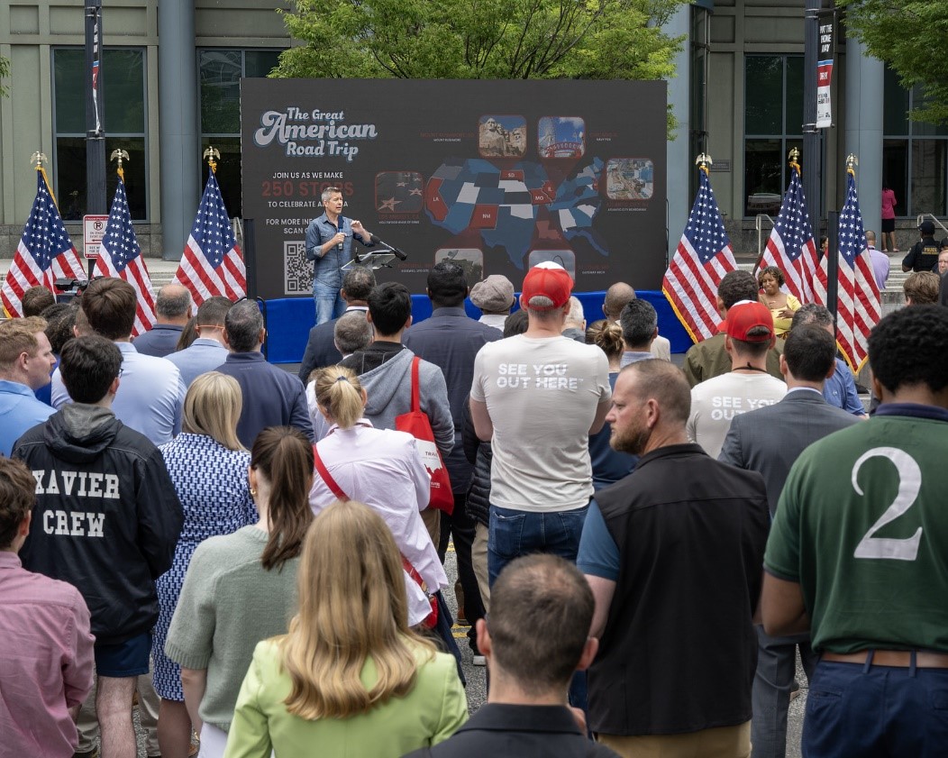 Secretary Duffy provides remarks in front of USDOT HQ in front of a crowd
