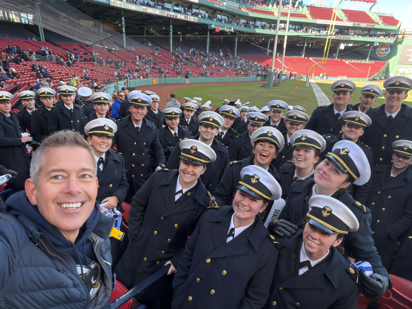 Secretary Duffy taking a selfie with midshipmen at Secretaries' Cup
