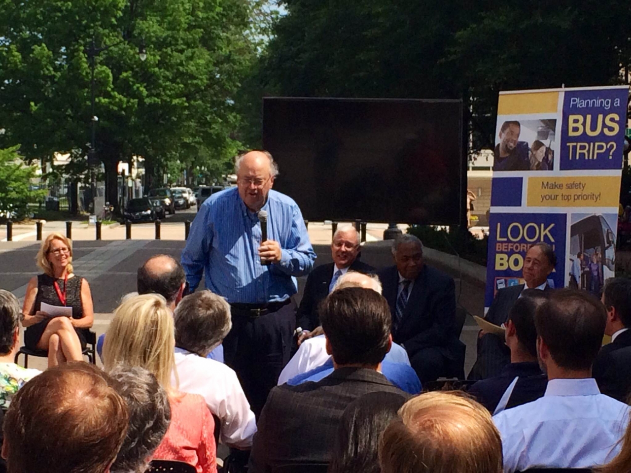 Photo of Delos Smith telling stories of his 48 states of bus travel