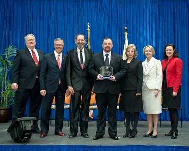 Photo of Chris Rhoads accepting his award