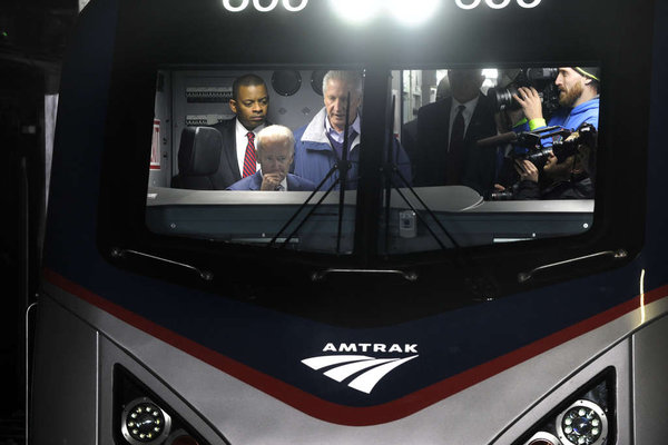 Photo of V.P. Biden and Secretary Foxx in the cab of the new Amtrak locomotive; photo courtesy Phildelphia Inquirer, Tom Gralish