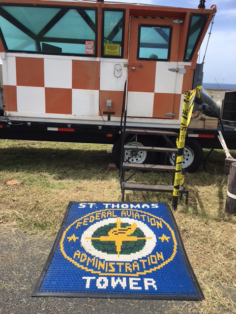 Mobile Air Tower with welcome mat that say St Thomas FA Tower