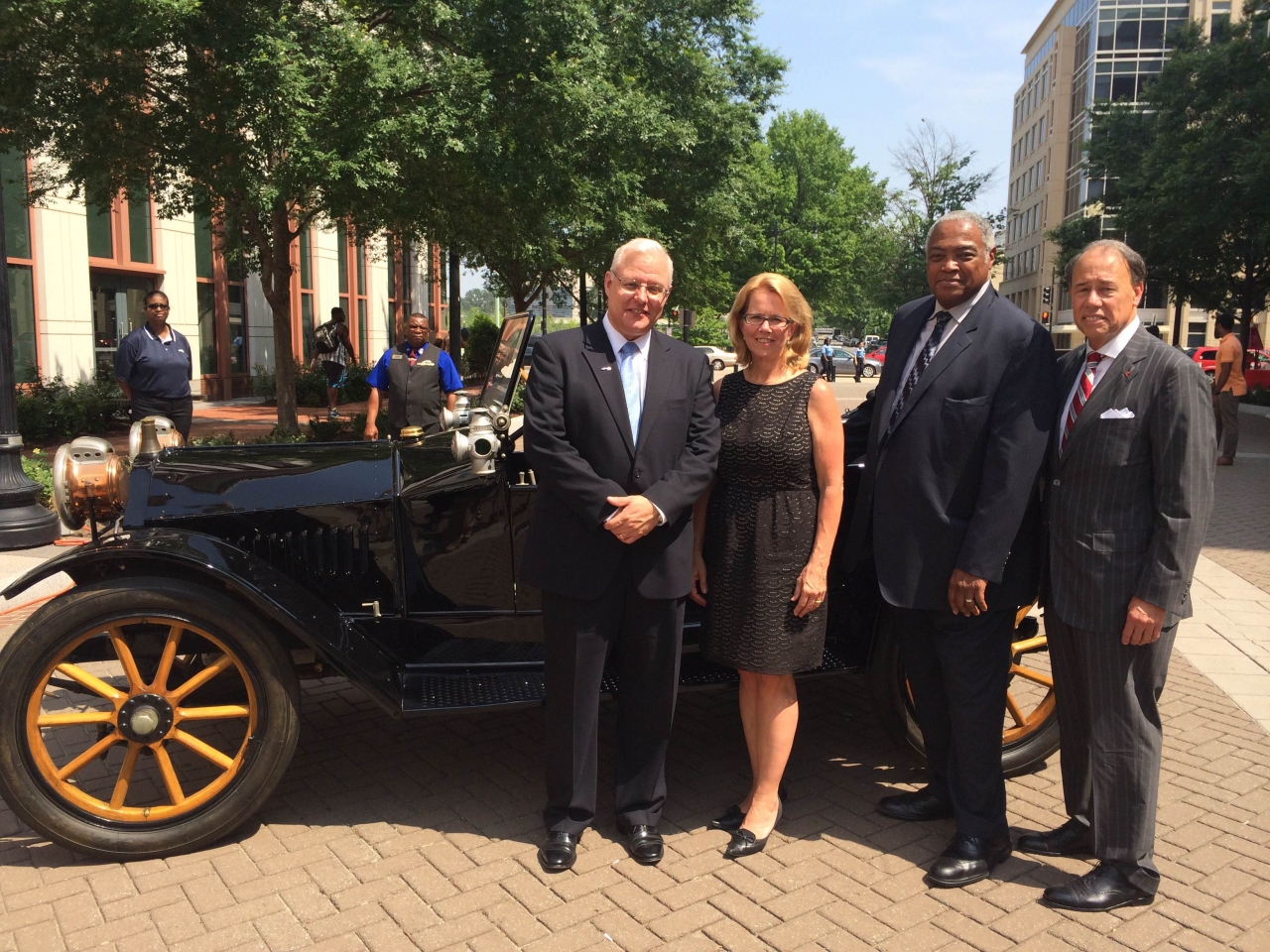 Photo of F.M.C.S.A. Administrator Anne Ferrro in front of 1914 Hupmobile