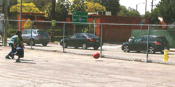 Photo of kids playing adjacent to cut-through traffic in Alhambra