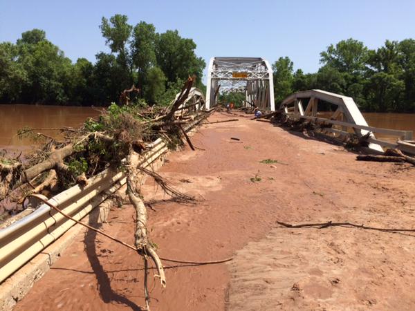 Flooding damages bridge in Oklahoma; photo courtesy @OKDOT.