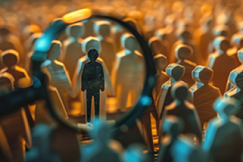A magnifying glass reveals a distinct human figure in a crowd.
