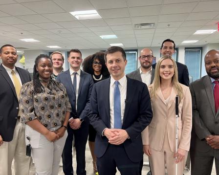 Secretary Pete in front of a group at DOT