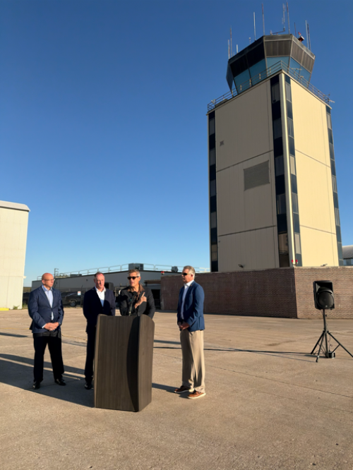 Secretary Duffy outside in front of MKC airport tower