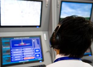 Photograph of an air traffic controller at his post