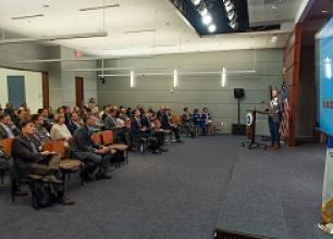 DOT staff gives a presentation on a pilot project at the Safety Data Forum