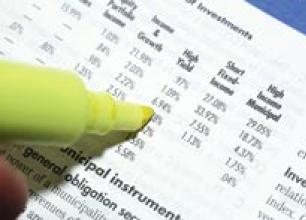 Stock photo of person using highlighter to point out data