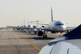 Aircraft awaiting takeoff on crowded tarmac Photos of aircraft awaiting takeoff